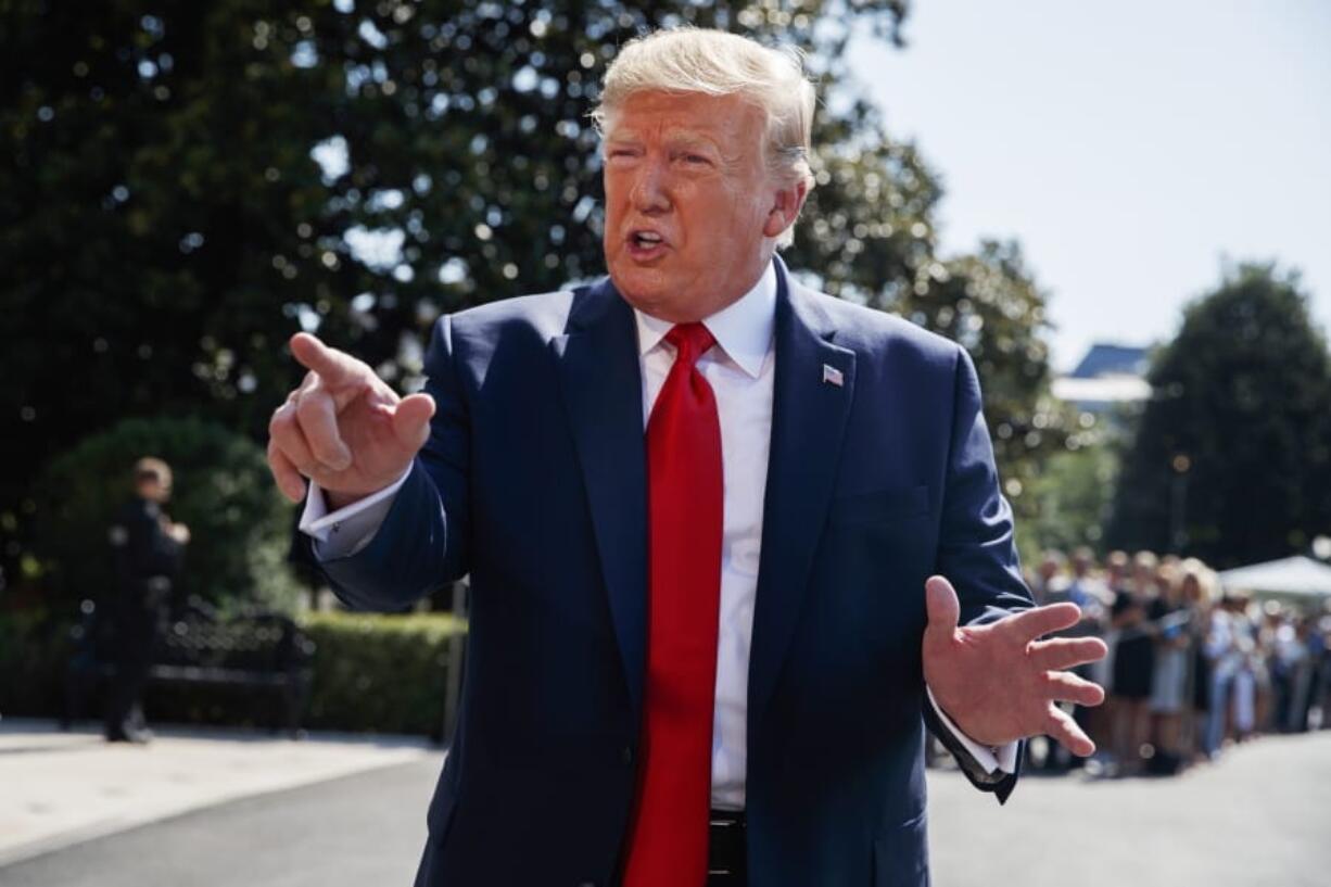 President Donald Trump talks to reporters on the South Lawn of the White House, Friday, Aug. 9, 2019, in Washington, as he prepares to leave Washington for his annual August holiday at his New Jersey golf club.