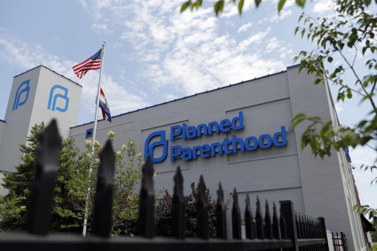 FILE- In this June 4, 2019, file photo, a Planned Parenthood clinic is photographed in St. Louis. Planned Parenthood says it will leave the federal family planning program by Monday, Aug. 19, unless a court puts a hold on Trump administration rules that bar clinics from referring women for abortions.