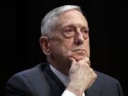 FILE - In this April 26, 2018, file photo, Defense Secretary Jim Mattis listens to a question during a hearing on Capitol Hill in Washington. Mattis warns bitter political divisions have pushed American society to the “breaking point” in his most extensive public remarks since he resigned in protest from the Trump administration.