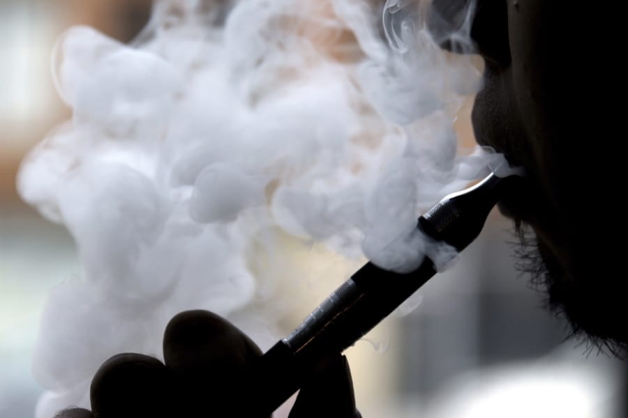 A man smokes an electronic cigarette in Chicago. (AP Photo/Nam Y.