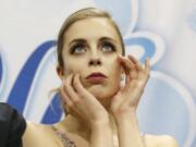 FILE - In this Jan. 5, 2018, file photo, Ashley Wagner waits for her scores during the women’s free skate event at the U.S. Figure Skating Championships in San Jose, Calif. Former Olympian Ashley Wagner says she was sexually assaulted by another figure skater in 2008 when she 17. The three-time national champion writes in USA Today on Thursday, Aug. 1, 2019, that John Coughlin climbed into her bed after a party at a skating camp and began kissing and groping her. Coughlin was 22 at the time and took his life in January at 33.