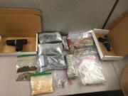 Vancouver police seized more than 13 pounds of heroin, over a pound of cocaine and methamphetamine and two guns from a Fisher&#039;s Landing East residence on Sept. 11.