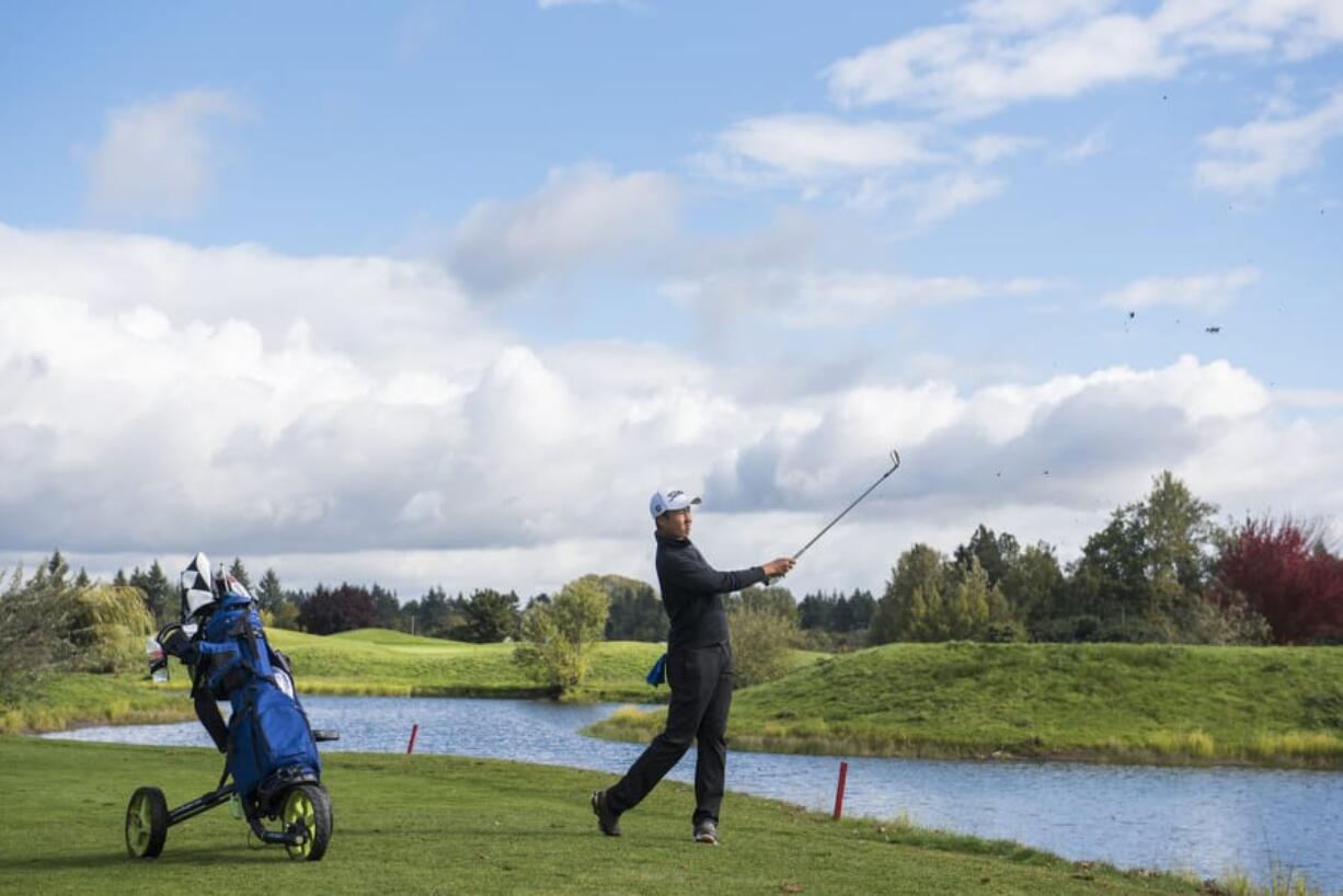 Mountain View’s Willy Yeh hits from the fairway during the 3A District Boy’s Golf Tournament Tri-Mountain Golf Course.