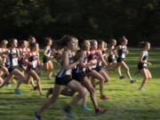 Camas runners, center, race during the 4A district meet.