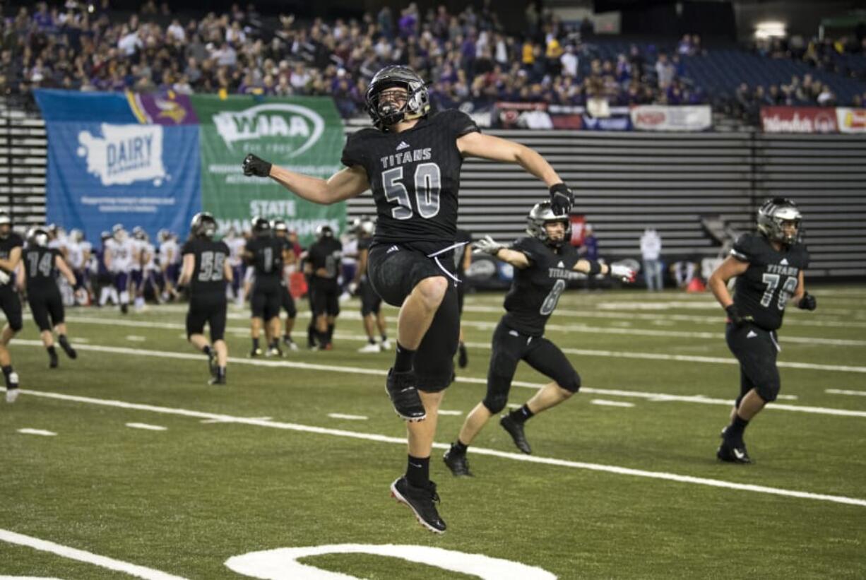 Union’s Tarek Jabakhanji (50) celebrates during the Titans’ victory in the 2018 Class 4A state football championship game. Union will be tested not only on a statewide level, but by strong league rivals Camas and Skyview.