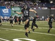 Union’s Tarek Jabakhanji (50) celebrates during the Titans’ victory in the 2018 Class 4A state football championship game. Union will be tested not only on a statewide level, but by strong league rivals Camas and Skyview.