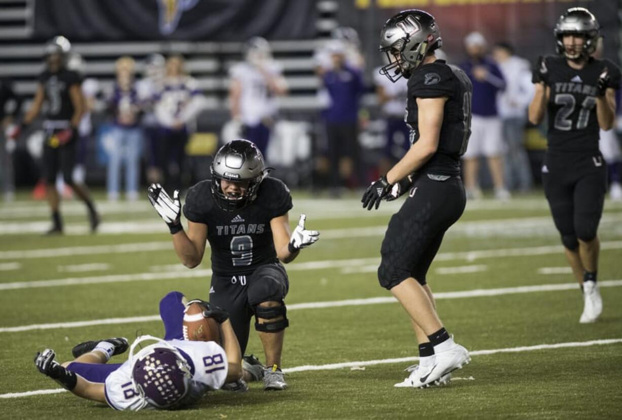 Union’s Justin Chin (9) celebrates a tackle during the Class 4A state football championship game. Despite graduating many key players, the Titans return several who contributed to the title run.