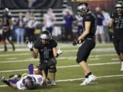 Union’s Justin Chin (9) celebrates a tackle during the Class 4A state football championship game. Despite graduating many key players, the Titans return several who contributed to the title run.