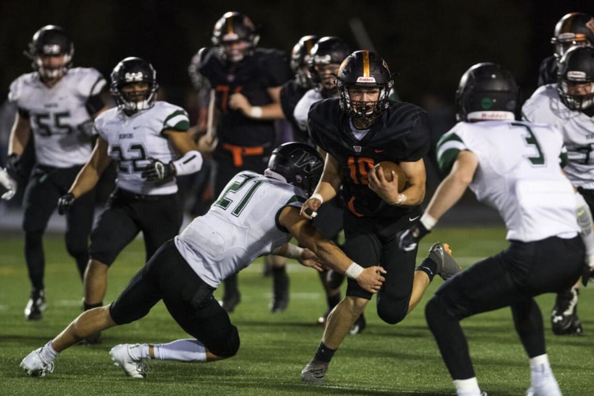 Washougal’s Peter Boylan (18) breaks through the Woodland defense. The Panthers are talented on both offense and defense, having allowed 23 points per game last season.