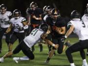 Washougal’s Peter Boylan (18) breaks through the Woodland defense. The Panthers are talented on both offense and defense, having allowed 23 points per game last season.