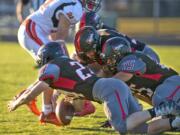 R.A. Long players fight for the ball in a game against Centralia. The Lumberjacks return no starters from last year’s team and might start up to 13 sophomores.