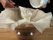 Spoon the yogurt into the cheesecloth.