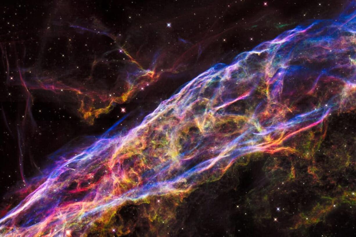 A small section of the Veil Nebula, a massive star that exploded about 8,000 years ago, is seen by NASA’s Hubble Space Telescope. The debris is one of the best-known supernova remnants.