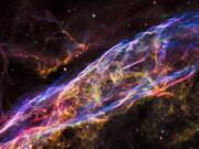 A small section of the Veil Nebula, a massive star that exploded about 8,000 years ago, is seen by NASA’s Hubble Space Telescope. The debris is one of the best-known supernova remnants.