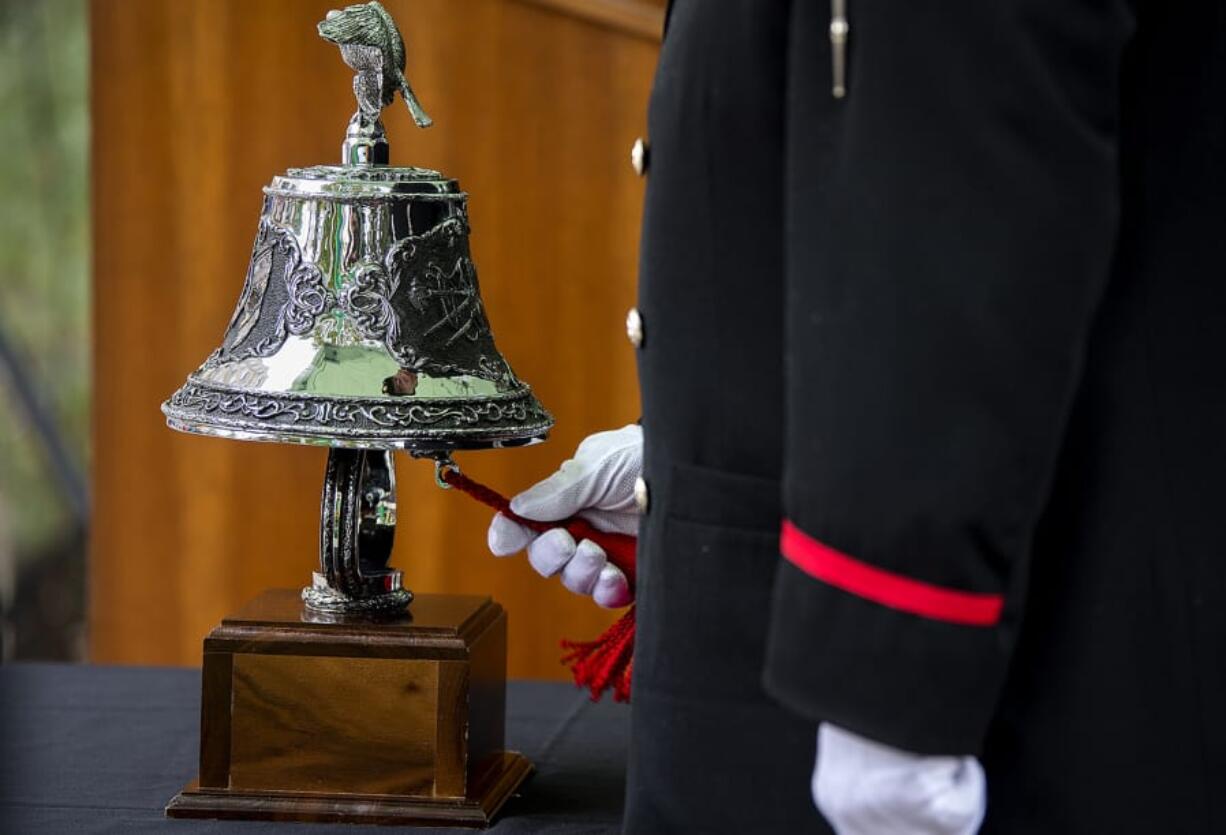 A member of the Vancouver Fire Department honor guard remembers fallen firefighters outside City Hall on Tuesday morning, Sept. 11, 2018.