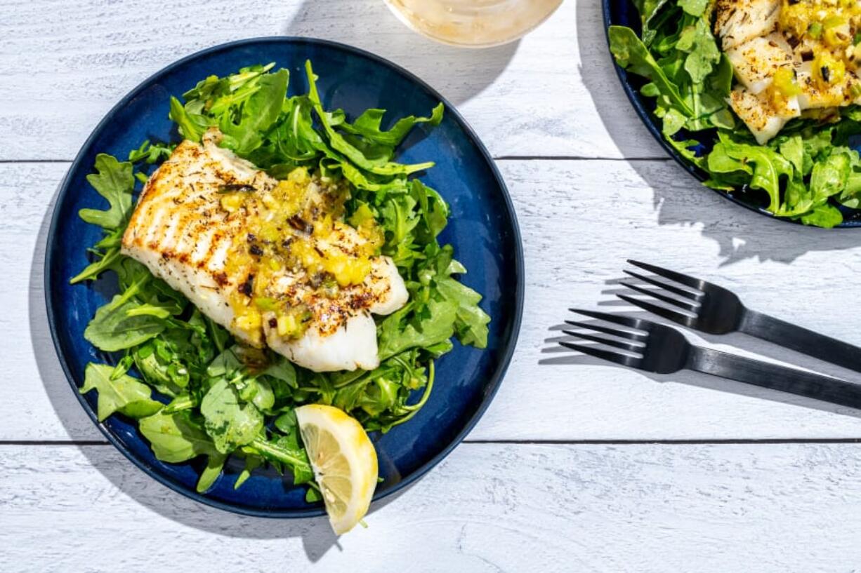 Cod with arugula and charred scallion vinaigrette.