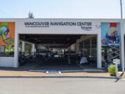 Catya Ledezma, top right, paints two murals on the Vancouver Navigation Center as part of the 2019 Summer of Murals Celebrations sponsored by the Clark County Mural Society last July.