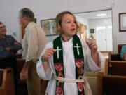 The Rev. Jess Felici speaks with parishioners at New Hope Lutheran Church in Upper Ract, W.V. before the first of three services she&#039;ll officiate. Felici and her husband Jason travel to five different services each Sunday that are part of the Mountain Lutheran Parish.