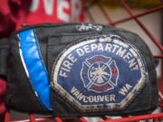 A Vancouver Fire Department patch is seen in the gear room of Fire Station 2.