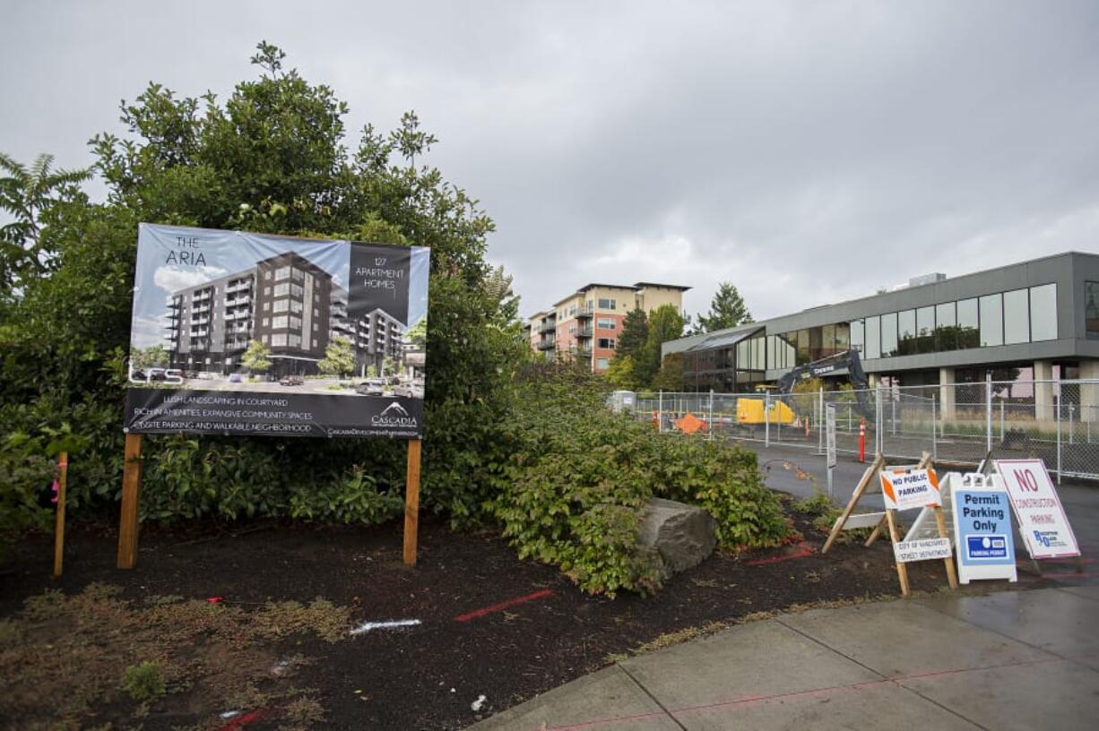 Construction is underway for The Aria apartments on West Sixth Street in downtown Vancouver. The apartments are being built by Cascadia Development Partners, which is headquartered in the Esther Short Building, visible on the right.