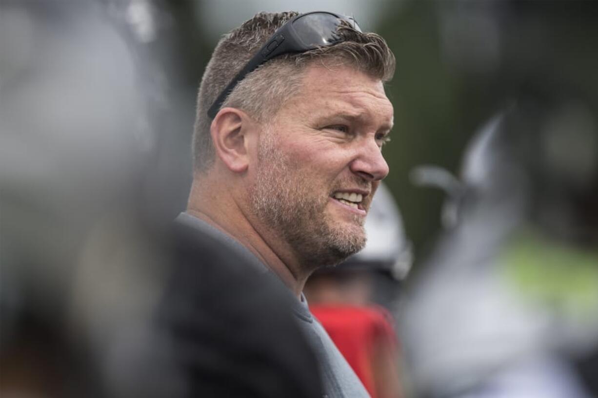 Union head football coach Rory Rosenbach works with his players during the first fall practice Aug. 22 at Union High School.