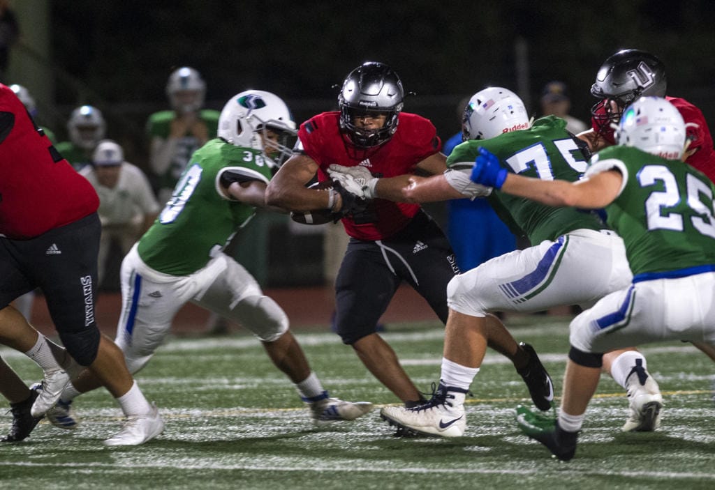 UnionÕs Isaiah Jones (2) tries to break through Mountain View defense during Friday nightÕs game at McKenzie Stadium in Vancouver on Sept. 6, 2019.