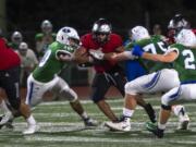 UnionÕs Isaiah Jones (2) tries to break through Mountain View defense during Friday nightÕs game at McKenzie Stadium in Vancouver on Sept. 6, 2019.