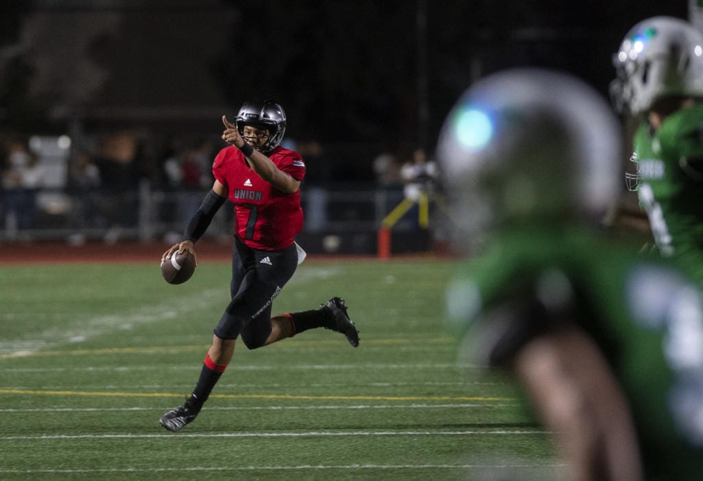 UnionÕs Caleb ÒCJÓ Jordan (7) looks to pass during Friday nightÕs game at McKenzie Stadium in Vancouver on Sept. 6, 2019.