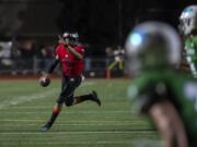 UnionÕs Caleb ÒCJÓ Jordan (7) looks to pass during Friday nightÕs game at McKenzie Stadium in Vancouver on Sept. 6, 2019.