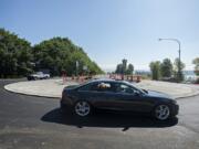 Drivers navigate the new roundabout at the intersection of state Highway 14 and Washougal River Road on Tuesday morning. Highway officials say the project is on schedule for completion later this year.