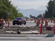 Drivers traveling west on State Highway 14 navigate the new roundabout at the intersection with Washougal River Road as Mount Hood is seen in the distance Sept. 3. Work on a second roundabout at 32nd Street will cause traffic delays starting Thursday.