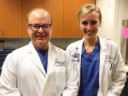 Washington State University medical student Christie Kirkpatrick poses with Dr. Douglas Whalen at Legacy Salmon Creek Medical Center in Vancouver. The photo was taken after Kirkpatrick helped Whalen deliver a baby in August. Whalen delivered Kirkpatrick at PeaceHealth St. John Medical Center in Longview about a quarter of a century ago.