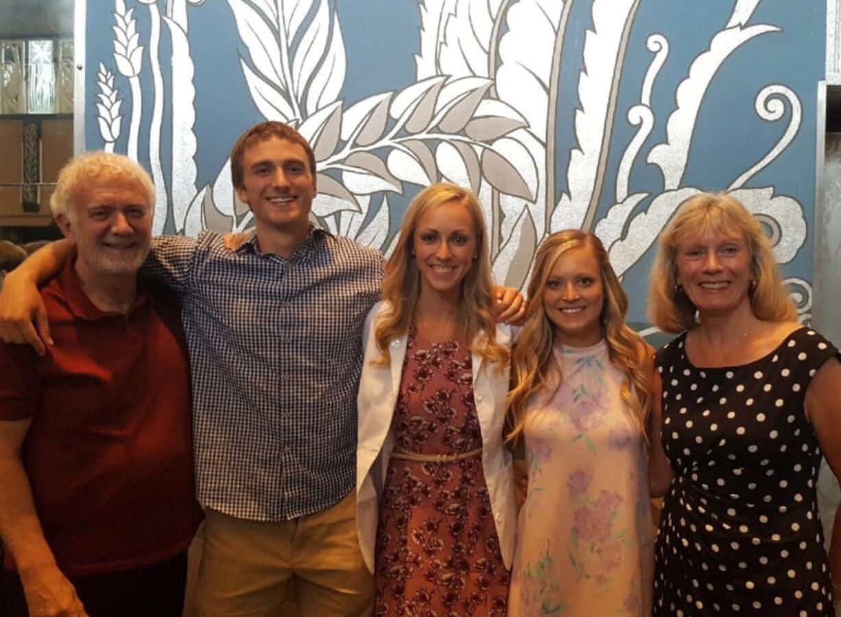 Rich Kirkpatrick, left to right, his son Scott, daughter Christie, daughter-in-law Courtney and wife Susie pose together for a picture. Rich runs a primary clinic in Longview, and both his kids are now studying medicine. They have discussed joining his clinic after medical school and residency is over.