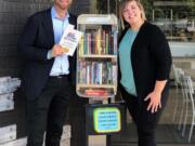 Fourth Plain Village: Trevor Haynes, CEO of Subway, and Traci Martin, vice president of operations for the local franchisee, at the new Free Little Community Library at a Vancouver Subway location on Fourth Plain Boulevard.