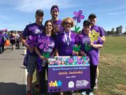 Camas resident Janis Jasinsky, center, poses for a photo at a previous Walk to End Alzheimer’s. She will walk in honor of her mother at Sunday’s Walk to End Alzheimer’s in Vancouver. “The first time you go to the walk, you’re surrounded by thousands of people who have all been impacted by the disease,” she said.