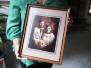 Fay Blackburn holds a photograph from her wedding to Reid Blackburn, a Columbian photographer who died while covering the 1980 Mount St. Helens eruption.