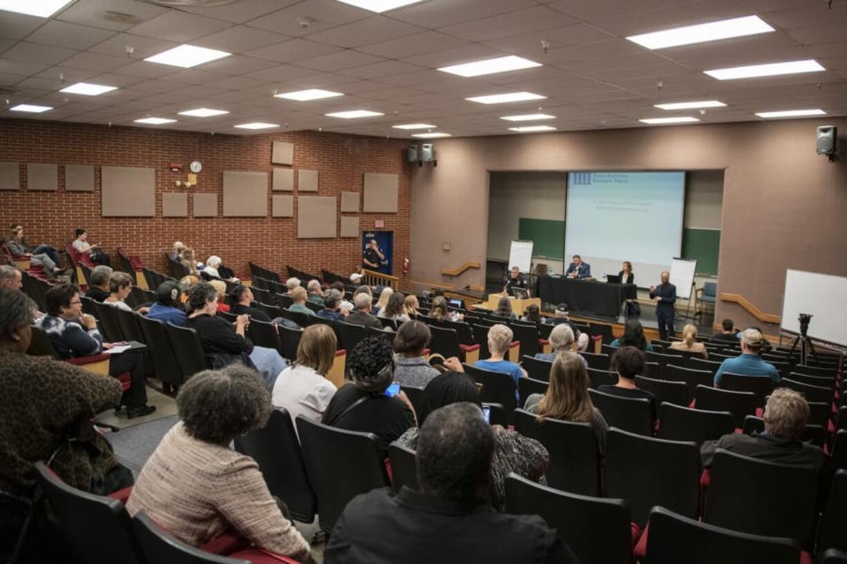 People gather Wednesday evening for a forum on the Vancouver Police Department’s use-of-force policies in the auditorium at Clark College’s Foster Hall.