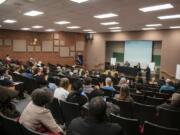 People gather Wednesday evening for a forum on the Vancouver Police Department’s use-of-force policies in the auditorium at Clark College’s Foster Hall.