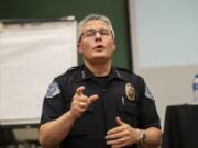 Vancouver Police Chief James McElvain speaks with an audience member during a forum on the department’s use-of-force policies in September 2019 evening at Clark College’s Foster Hall.