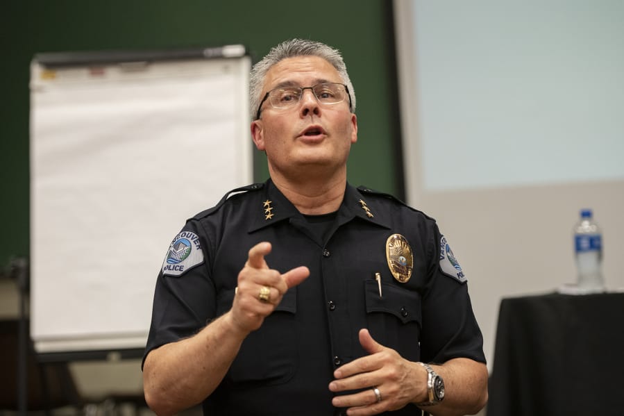 Vancouver Police Chief James McElvain speaks with an audience member during a forum on the department’s use-of-force policies in September 2019 evening at Clark College’s Foster Hall.