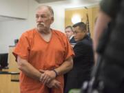 Dennis D. Bogle, 58, left, of Vancouver, makes a first appearance in Clark County Superior Court on Monday morning.  Bogle stands accused of vehicular homicide for a fatal hit-and-run in east Vancouver on Thursday night.