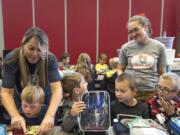 Amy Campbell, standing at right, is a special education teacher at Helen Baller Elementary School and the 2020 Washington State Teacher of the Year. Campbell, seen visiting with students at lunch period Monday, said she is focused on including her special education students in with the rest of the school to build community, empathy and relationships.