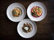 The Columbia River steelhead, clockwise from left, the Pacific prawns and the braised shortrib stroganoff at Skamania Lodge&#039;s Cascade Dining Room in Stevenson.