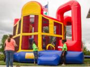 In addition to handing out backpacks filled with school supplies, Woodland Public Schools&#039; third annual Back to School Bash also allowed kids to play in bounce houses.