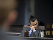 Mitchell Heng becomes emotional as he listens to audio recordings while taking the stand in his murder trial in Clark County Superior Court on Wednesday afternoon.