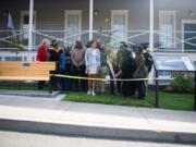 Wilson Keller cuts the ribbon for his Eagle Scout project with family members of Willie Morehouse, who served as a Buffalo Soldier, at the Fort Vancouver infantry barracks on Saturday, September 21, 2019. Keller's project was a memorial for Buffalo Soldiers who served in the American West.