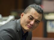 Mitchell Heng becomes emotional after hearing the guilty verdict in his murder trial in Clark County Superior Court on Thursday evening. In addition to first-degree murder, the jury convicted Heng of first-degree arson. He was acquitted of first-degree robbery.