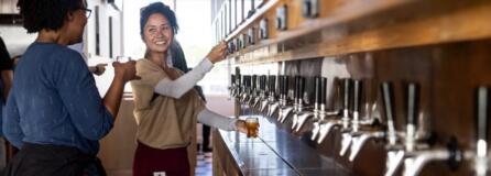 Lisa Harris of Vancouver, left, and Erica Nuth of Beaverton, Ore., taste different beers at the newest Waterfront Vancouver restaurant, Barlow&#039;s Public House. Barlow&#039;s has one of the first self-serve tap walls in the Portland area. Customers are given a card that is connected to their bill, and each pour is calculated and tallied.