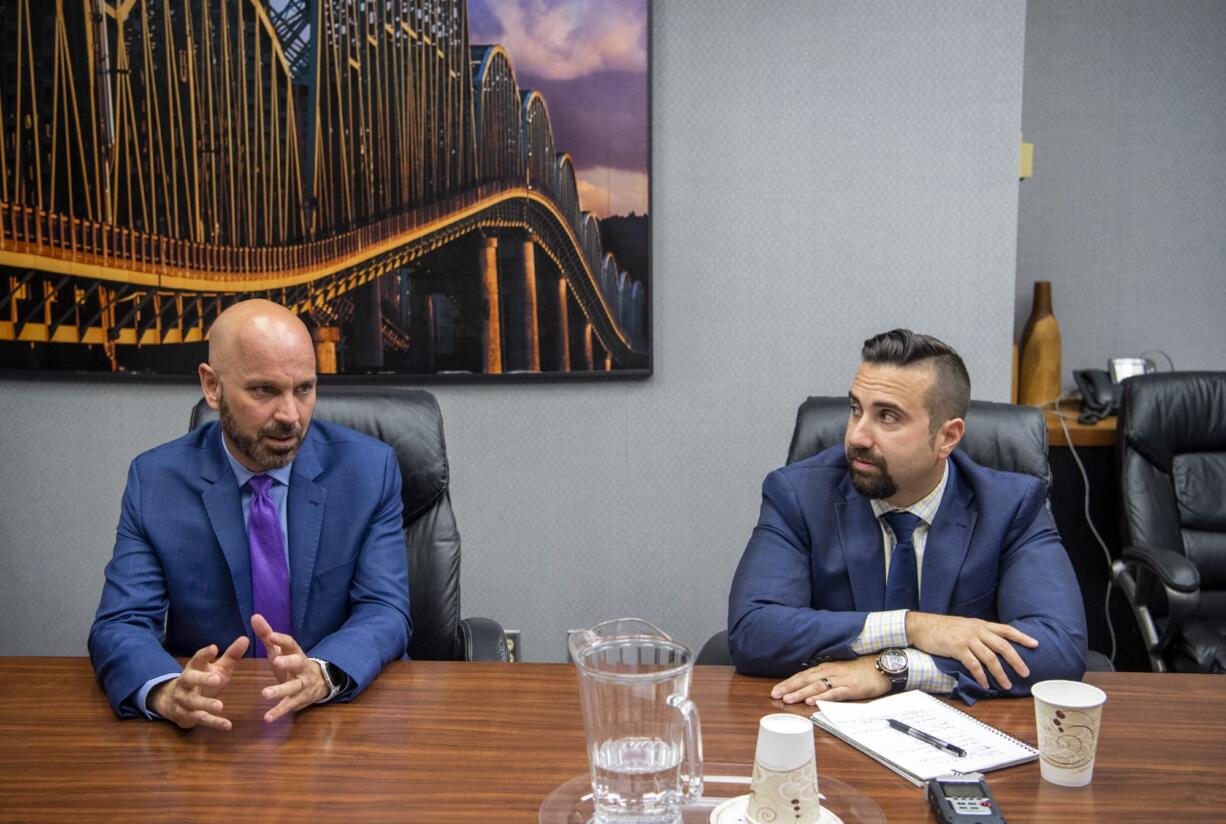 Ty Stober, Vancouver City Council Position 5 incumbent, left, and David Regan, candidate for Vancouver City Council Position 5, right, speak with The Columbian's Editorial Board on Wednesday.