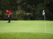 Camas&#039; Owen Huntington putts the ball during the Titan Cup golf tournament at Camas Meadows Golf Course on Monday.